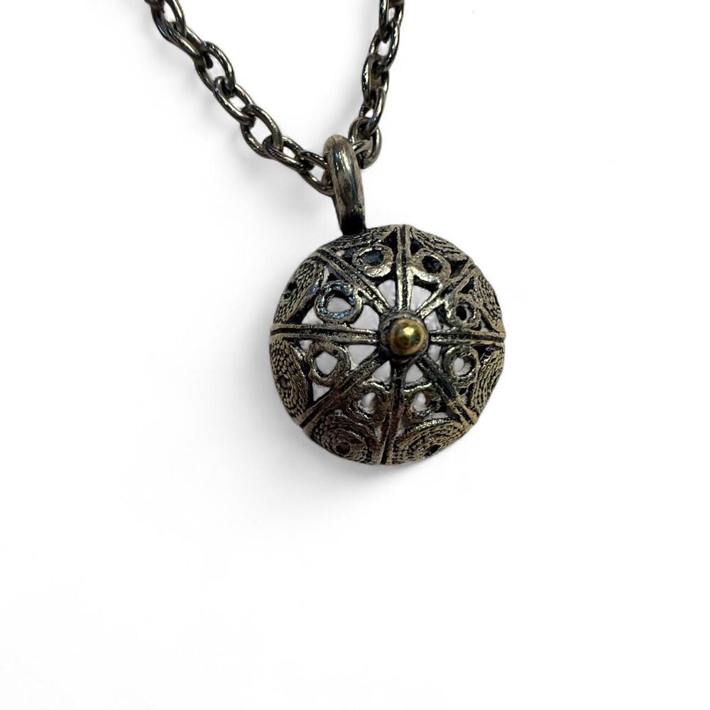 Vintage sterling silver pendant necklace with intricate filigree design